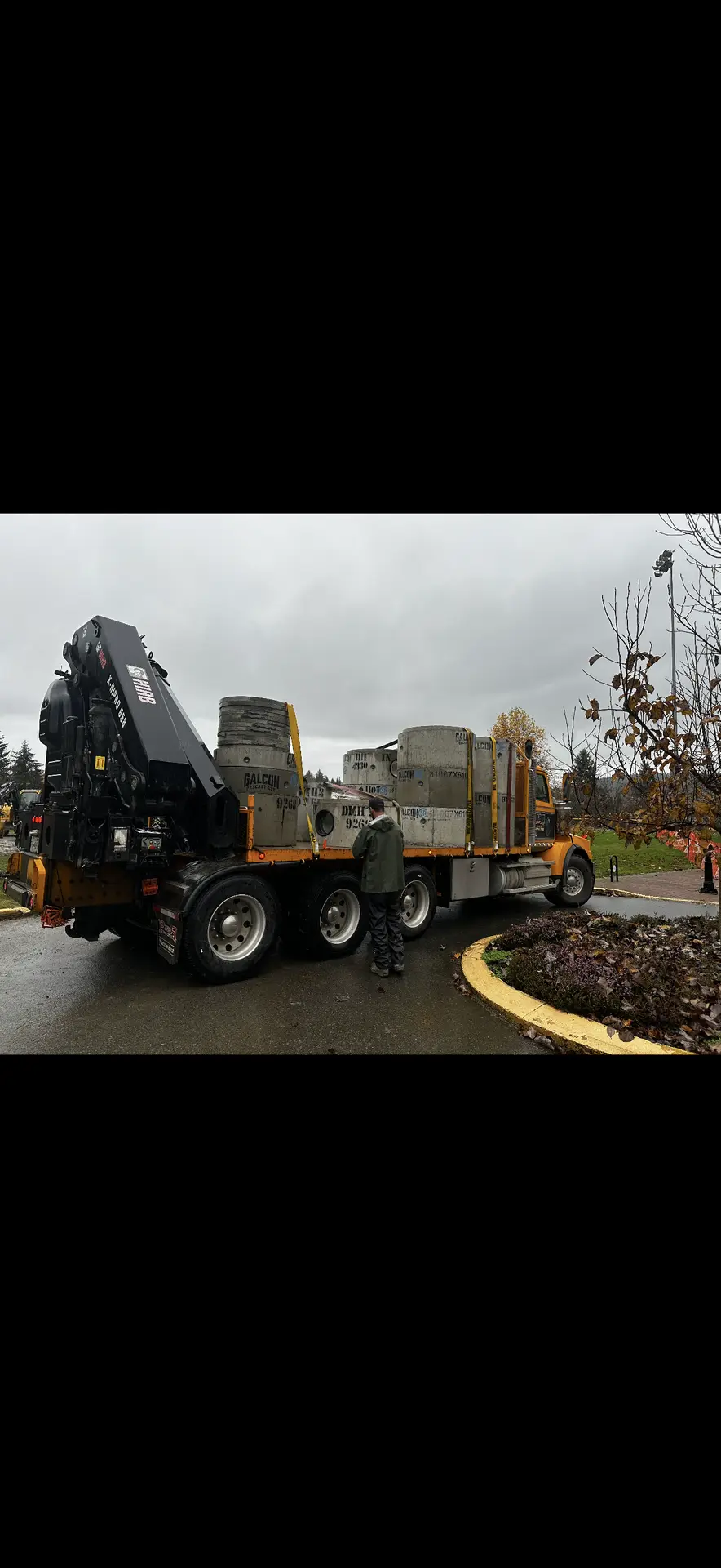 Crane truck delivering trench boxes and materials