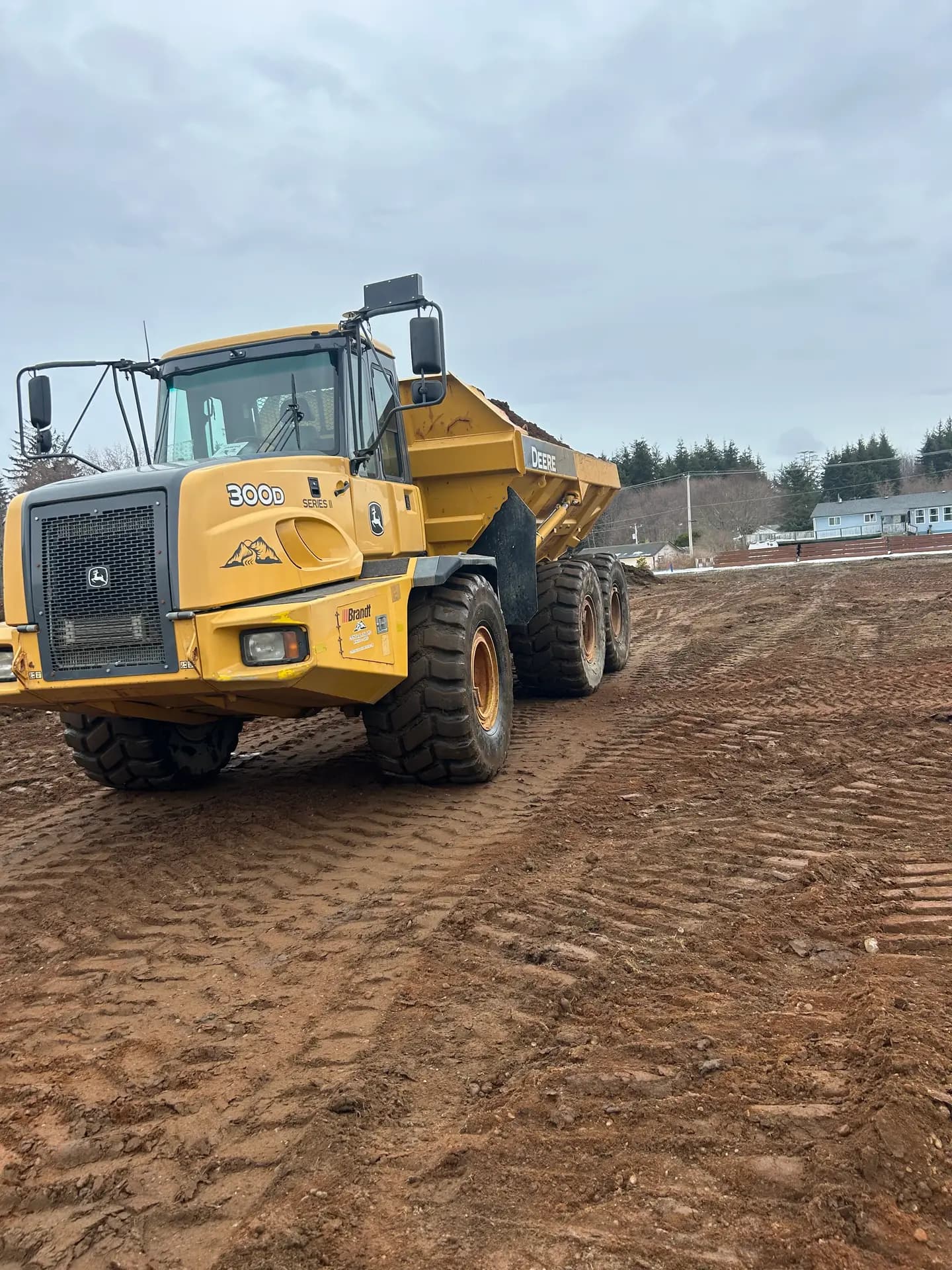 John Deere articulated rock truck on a mass excavation site