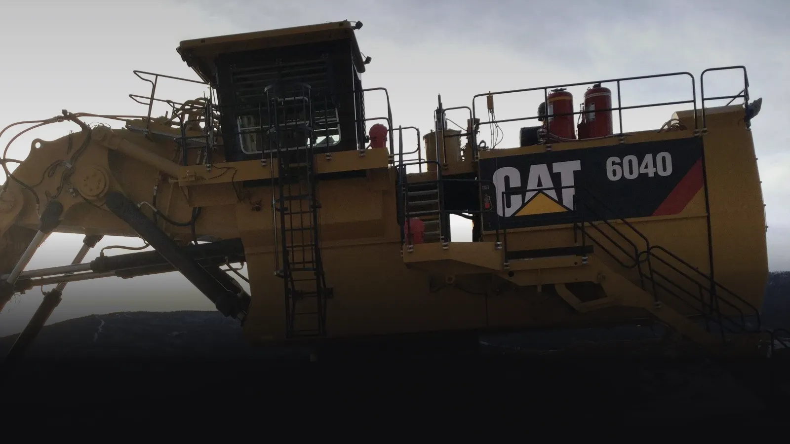 Illaheechuck Civil Construction banner over a large hydraulic excavator, excavation company in Campbell River, BC