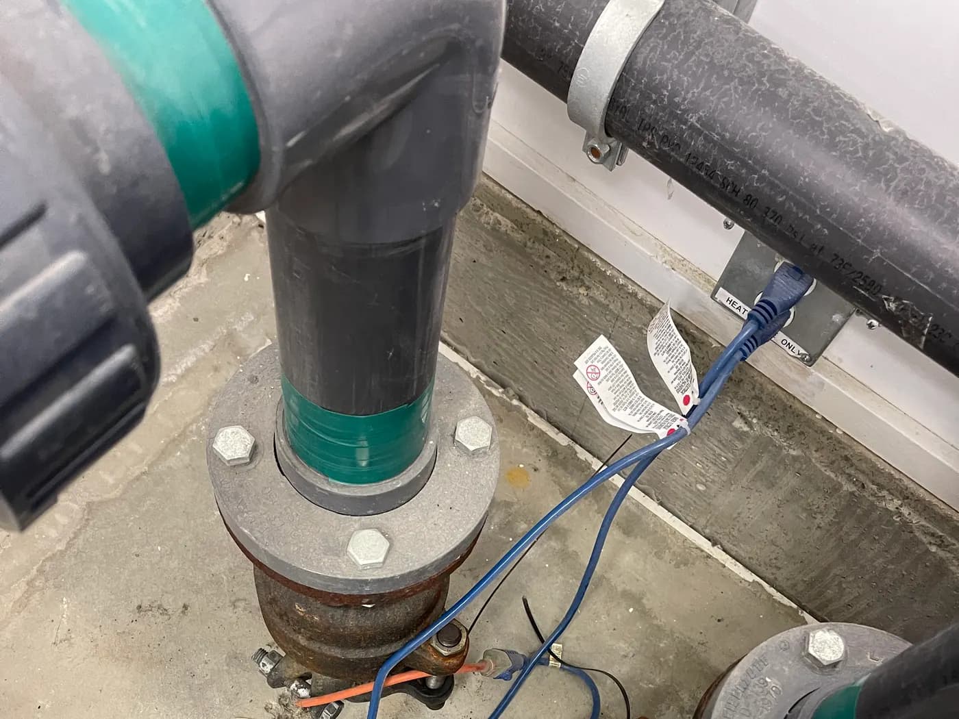 Flanged watermain riser connections with tracer wire ready for tie-in